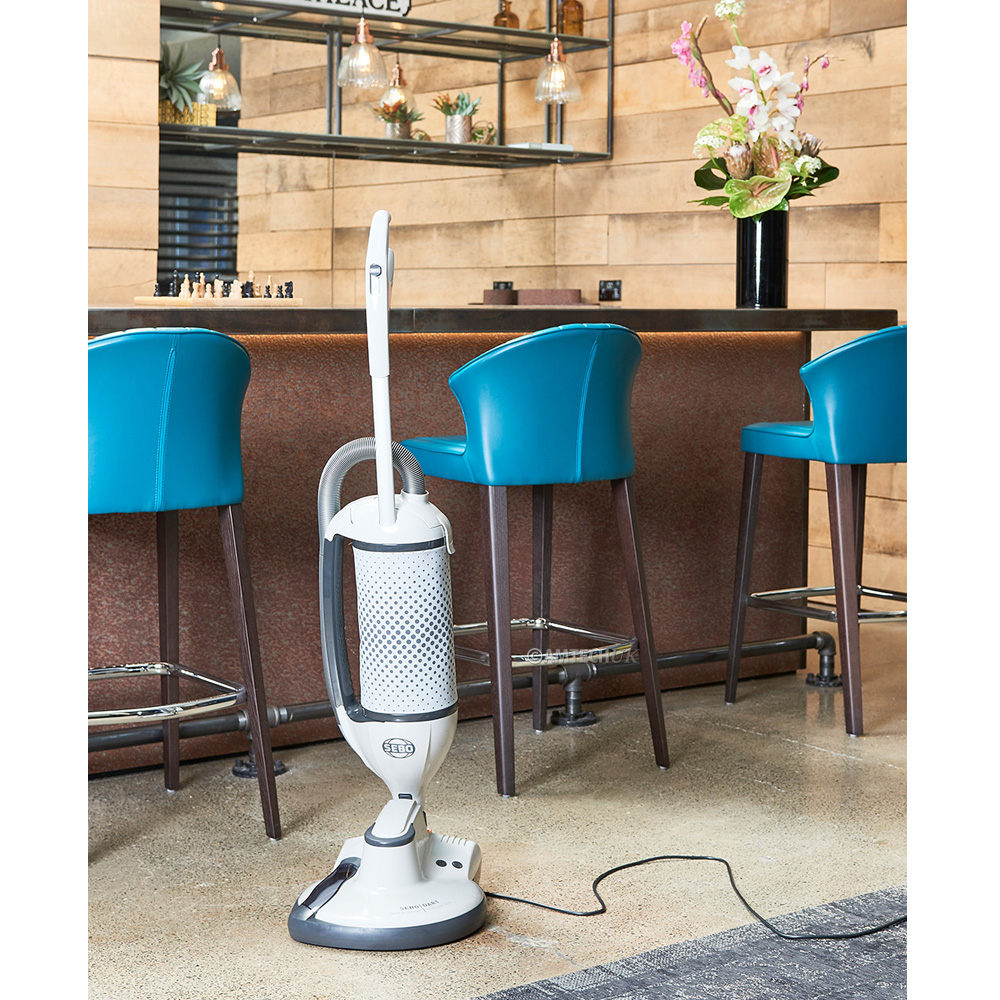 The SEBO DART 3 burnisher being used in a bar restrant setting.